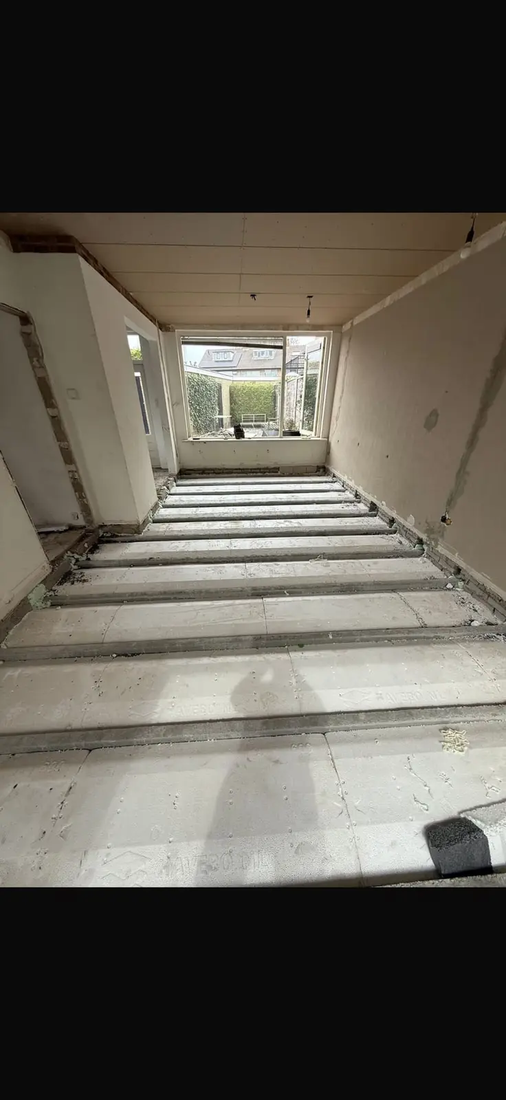 Trap en hal tijdens de renovatie in Putten